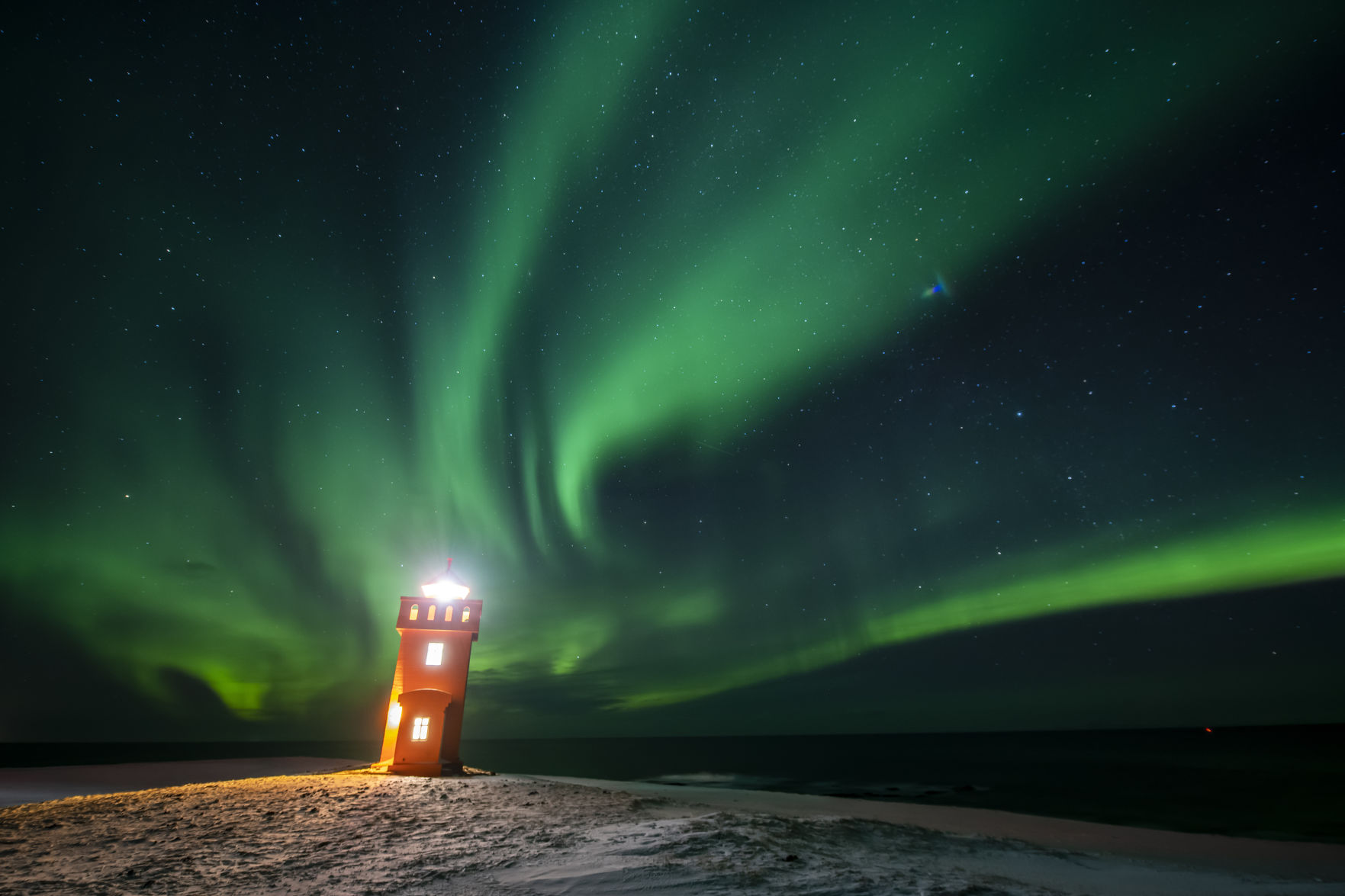 APTOPIX Iceland Aurora Borealis Lighthouse